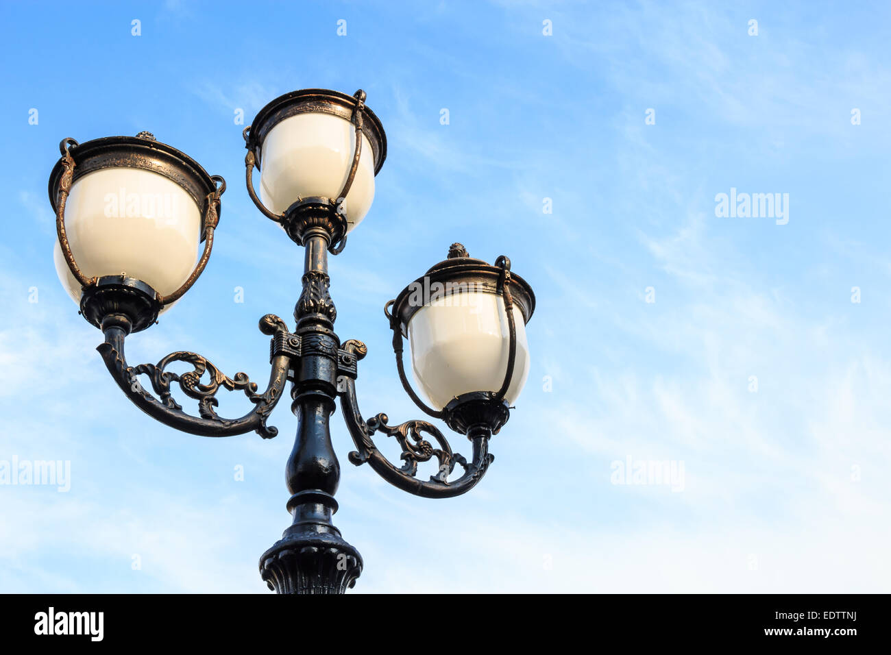 detail of streetlamp with blue sky in morning Stock Photo