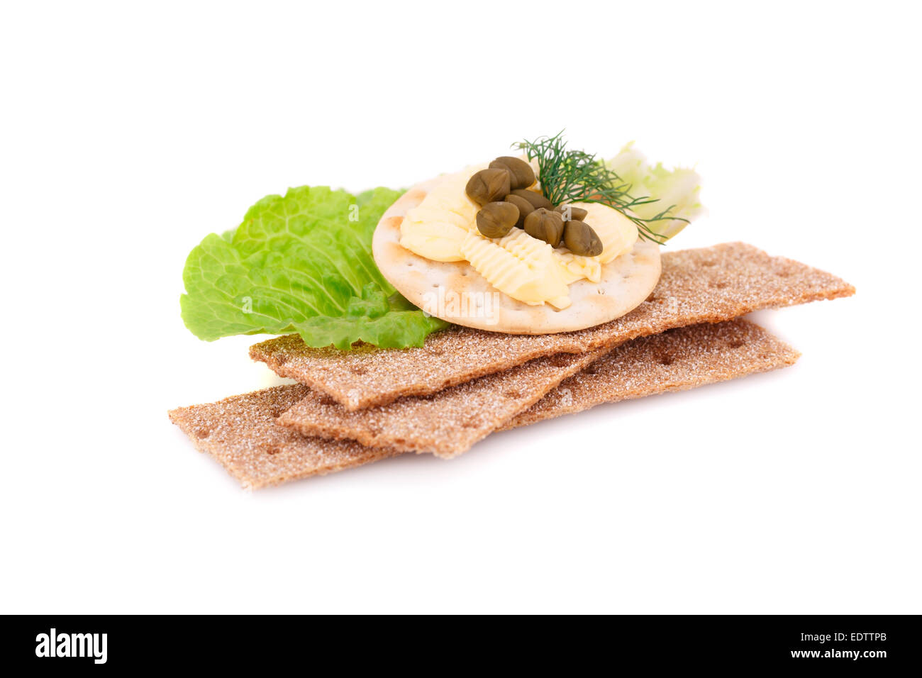 Crackers with fresh vegetables and butter isolated on white background ...
