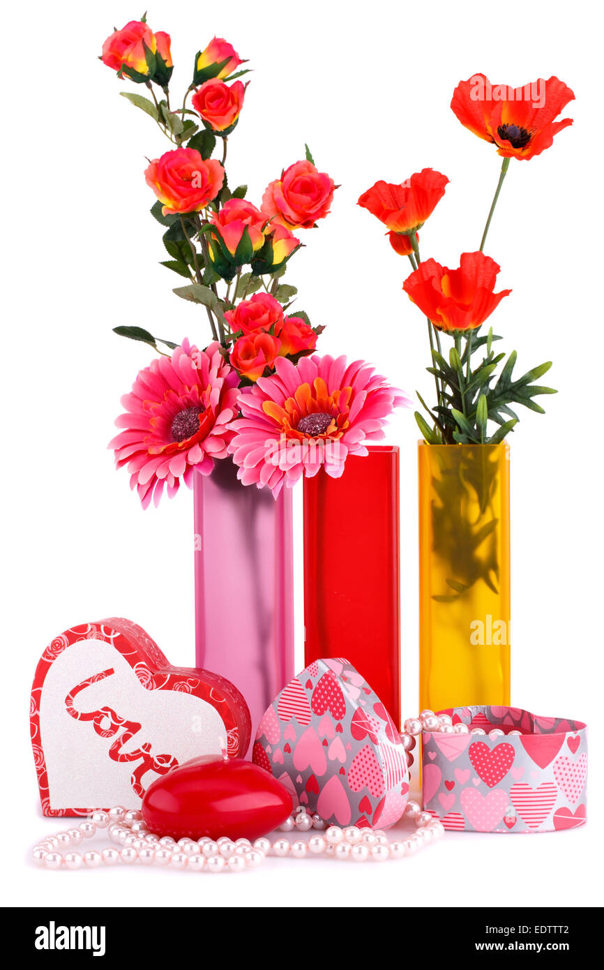 Flowers in vases, red heart candle, necklaces, gift boxes isolated on