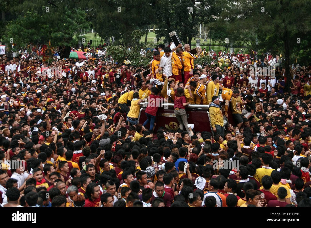 The Black Nazarene makes its way along P. Burgos Avenue amidst a sea of people trying to touch it, in front of the National Museum. About two million devotees took part in the annual procession of the Black Nazarene that usually last twenty-four hours. One devotee has been reported dead, due to heart attack, during the early part of the procession. © J Gerard Seguia/Pacific Press/Alamy Live News Stock Photo