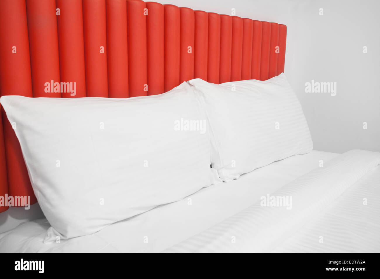 Bed with headboard and pillows Stock Photo Alamy