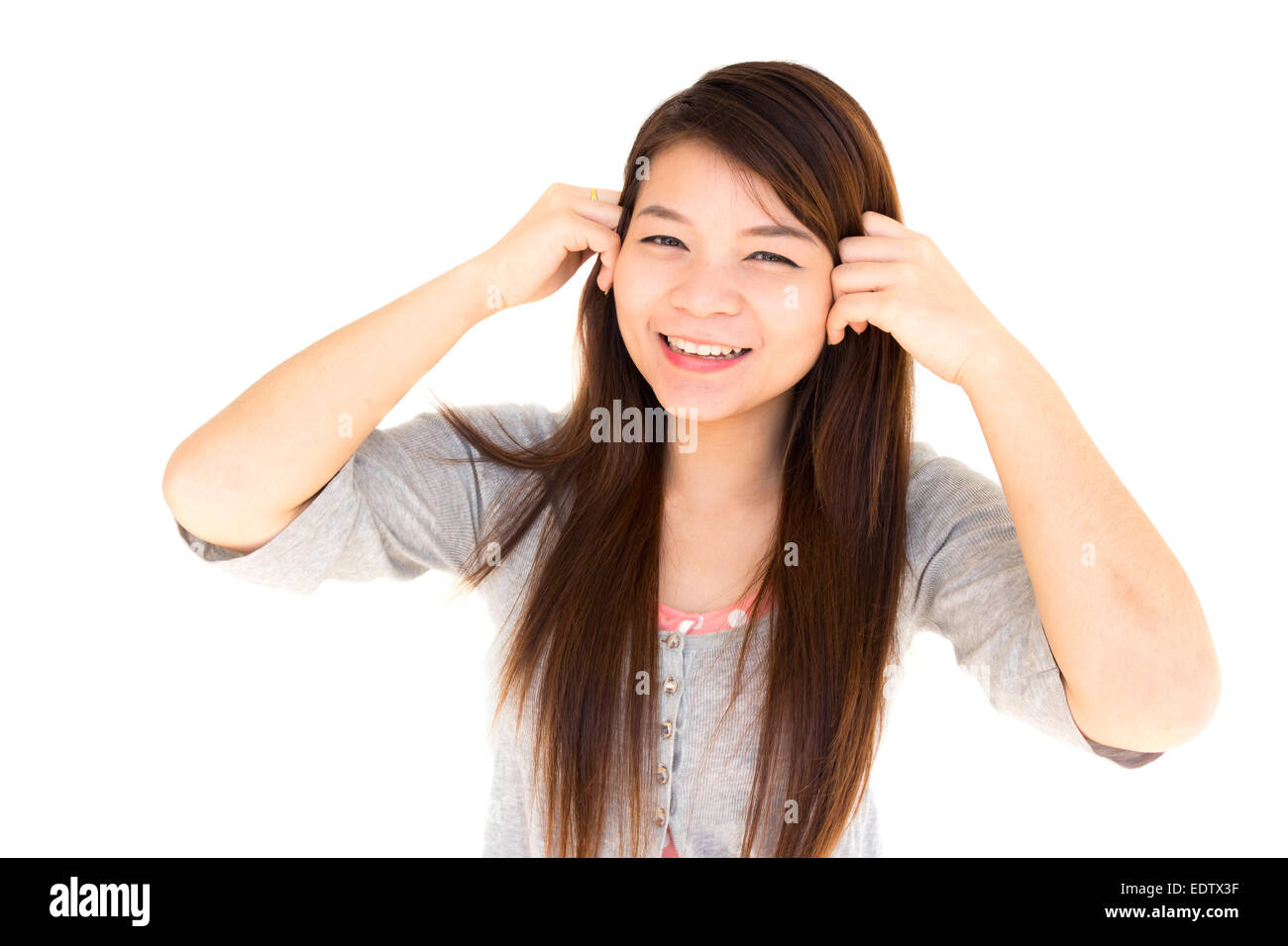 round face thai woman is happy and hold her hair on white background Stock Photo