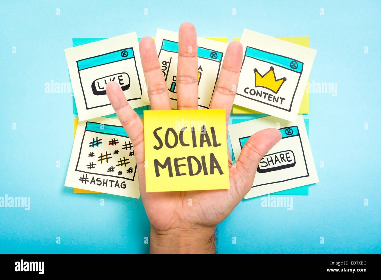 Social media on hand with blue background Stock Photo