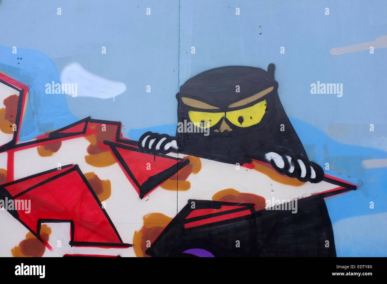 Islamic woman Cartoon Graffiti on a wall in Shoreditch, London Stock Photo