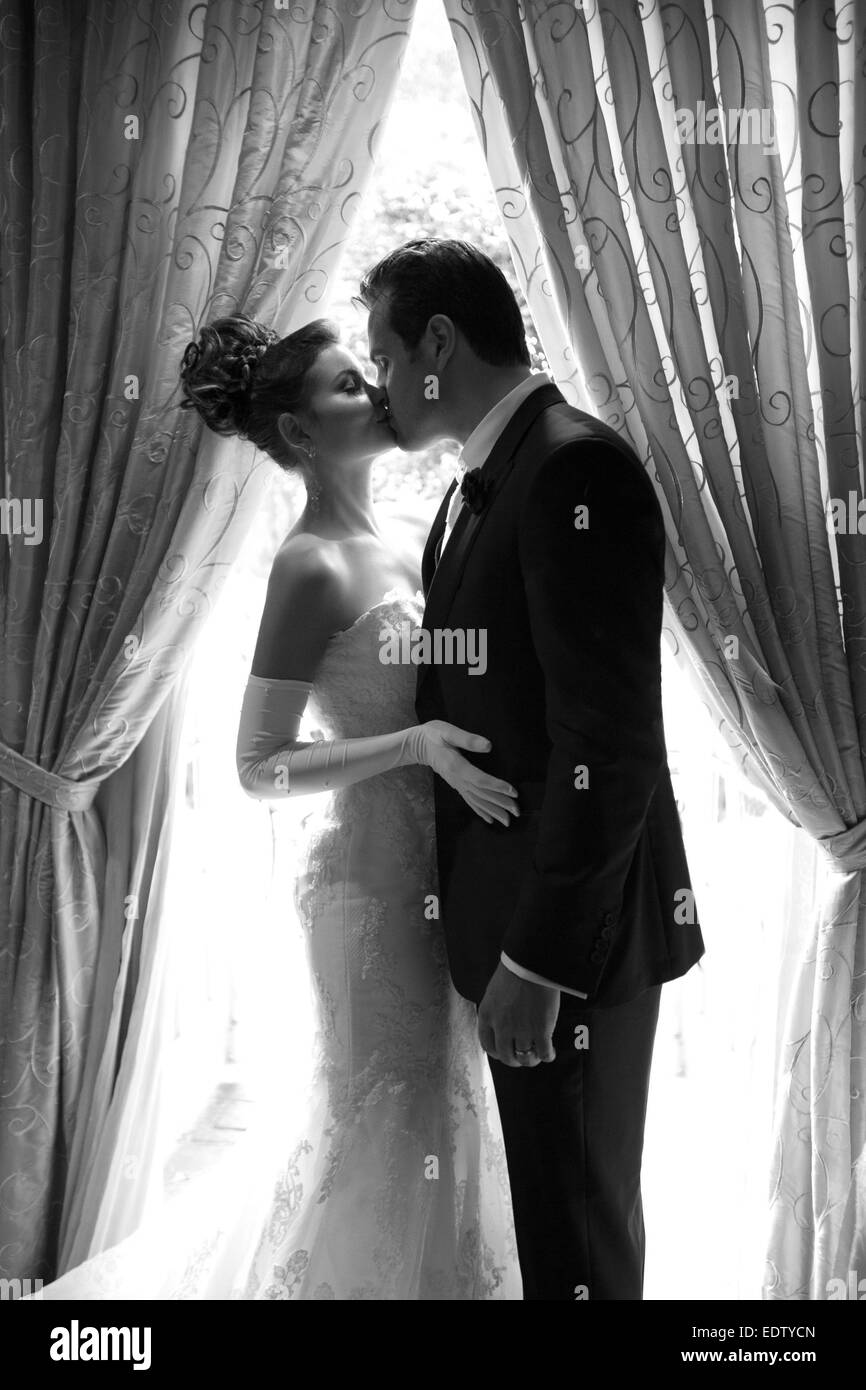 Bride and groom kissing Stock Photo - Alamy