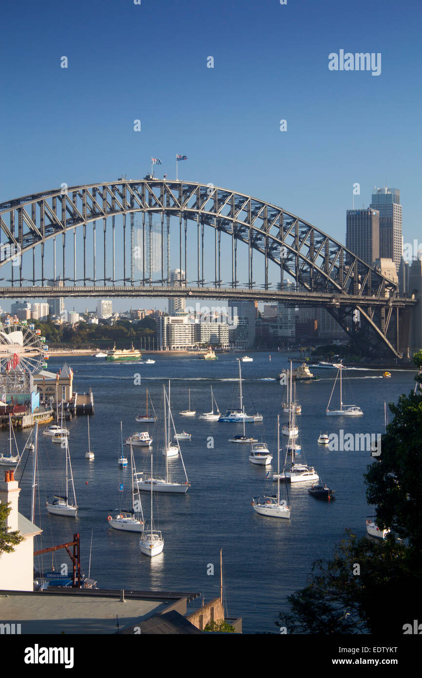 Lavender Bay boats in harbour view to Sydney Harbour Bridge and CBD skyline at sunset North Shore Sydney NSW Australia Stock Photo