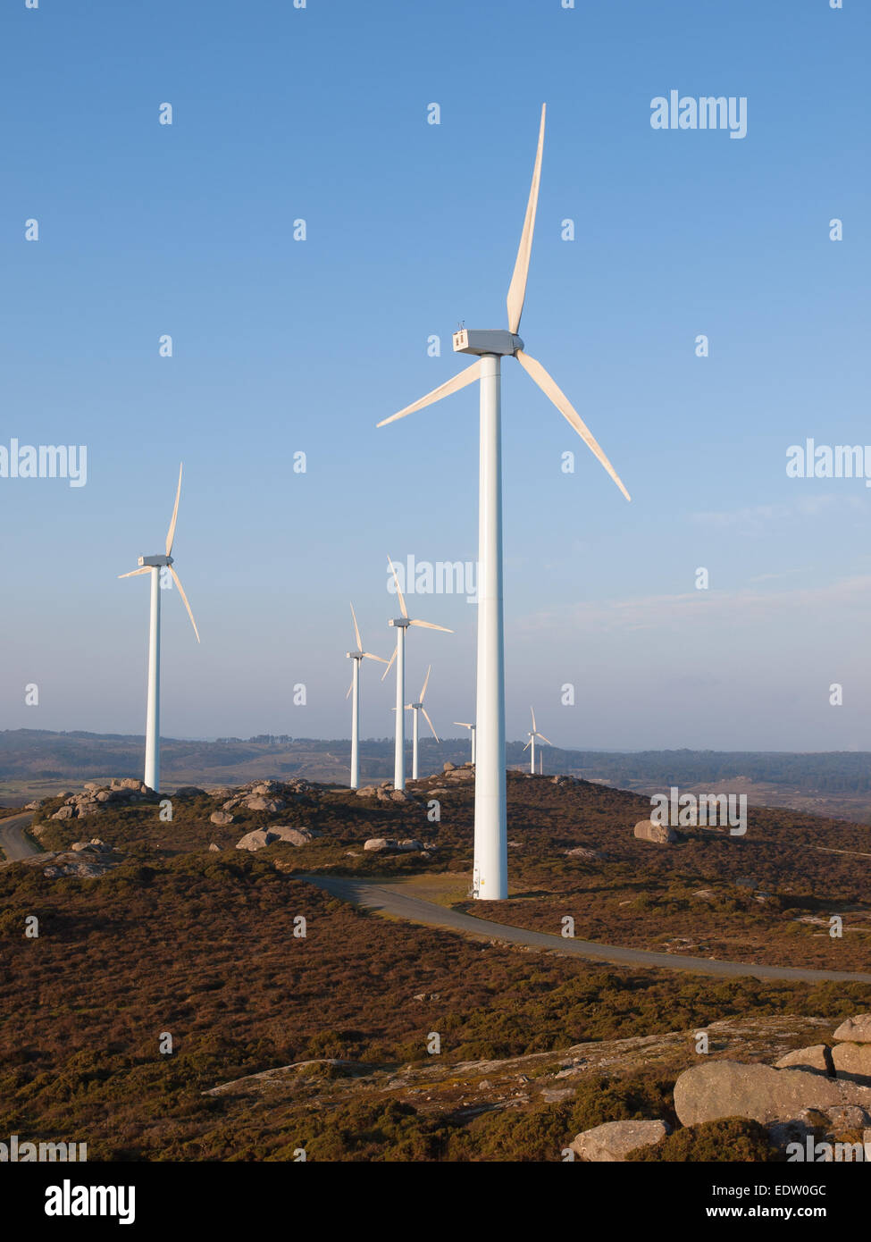 Three wind turbines in a landscape, vertical composition Stock Photo ...