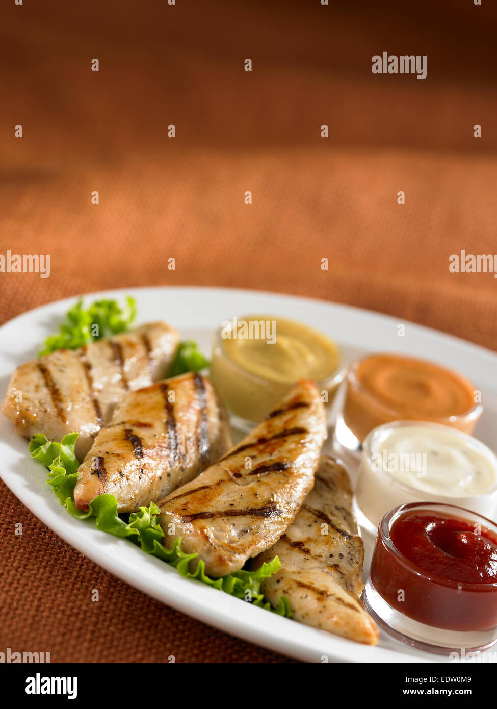 Chicken tenders and sauces Stock Photo