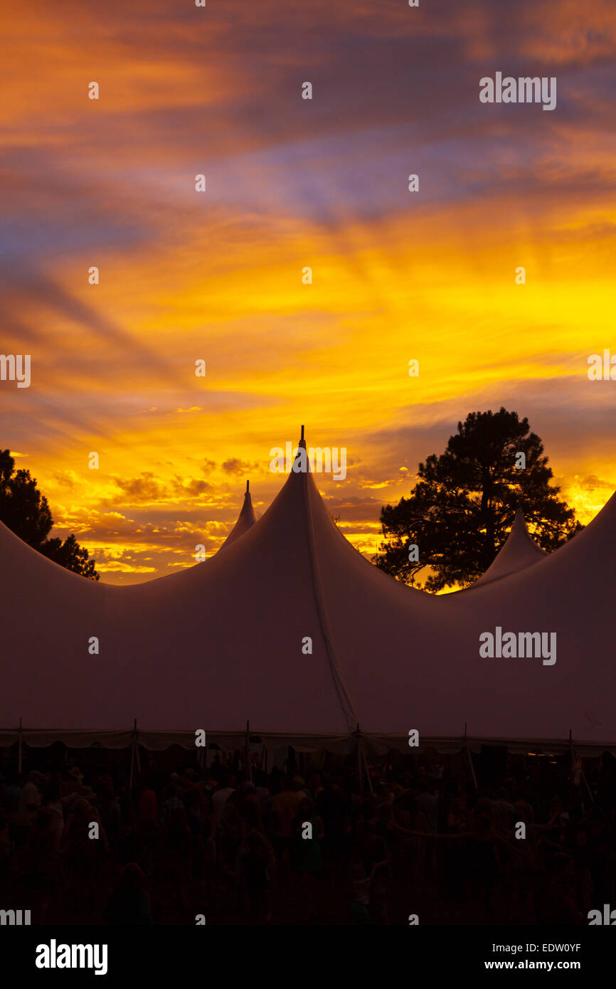The sun sets over the performance tent at the 2014 FOUR CORNERS FOLK FESTIVAL - COLORADO Stock Photo