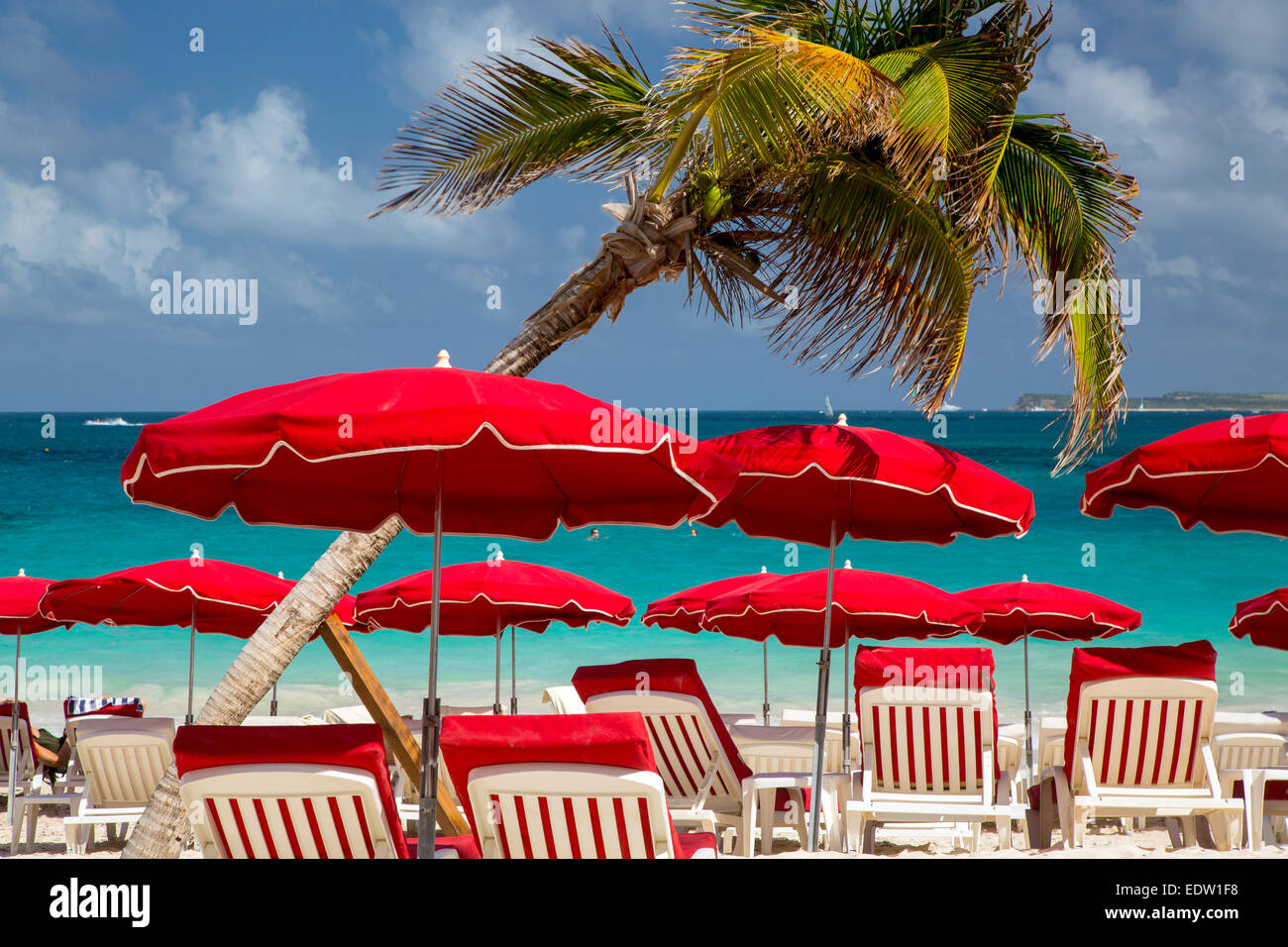 Umbrellas along Orient Beach, Saint Martin, West Indies Stock Photo