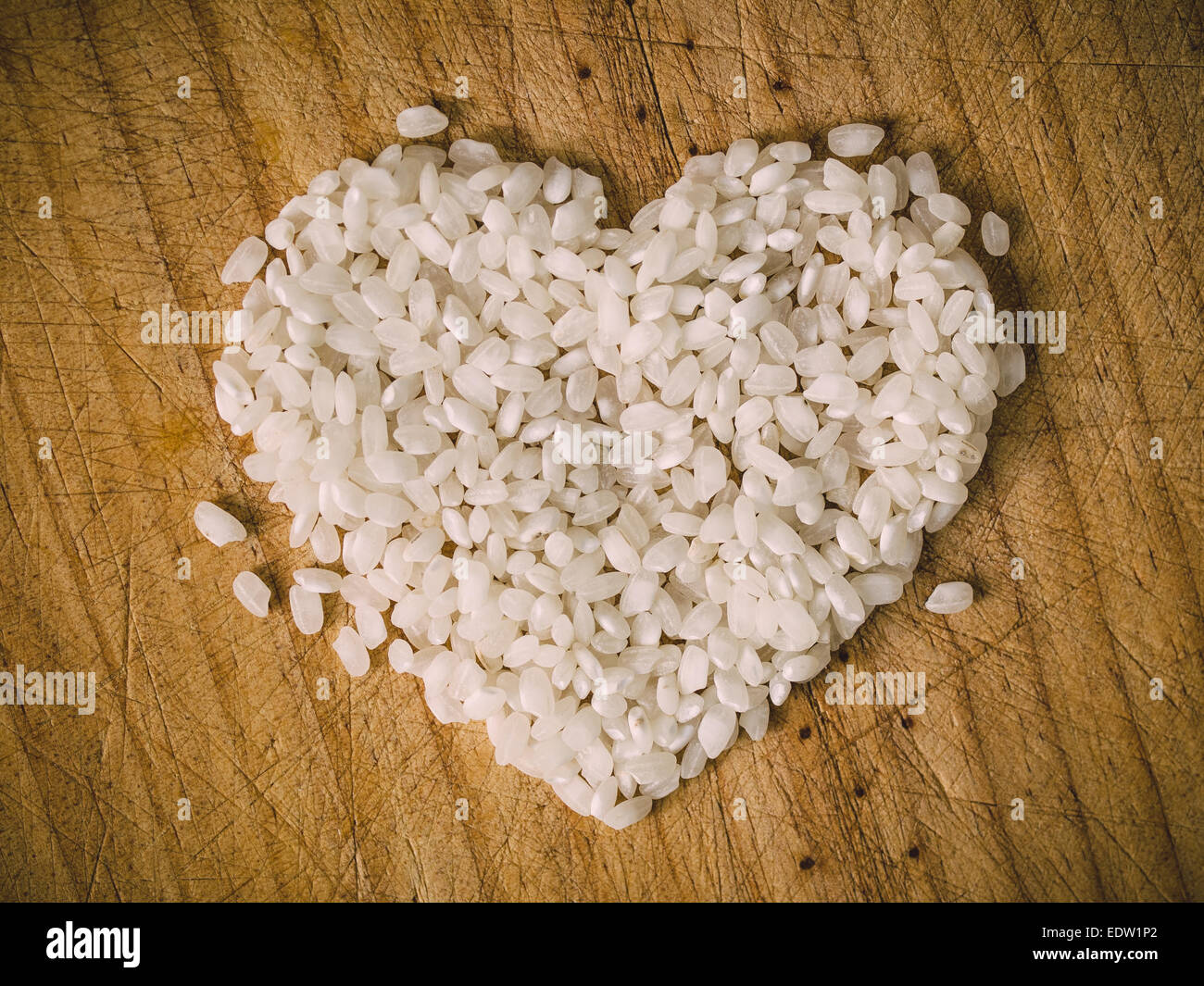 Rice heart on wooden background in a overhead shot Stock Photo