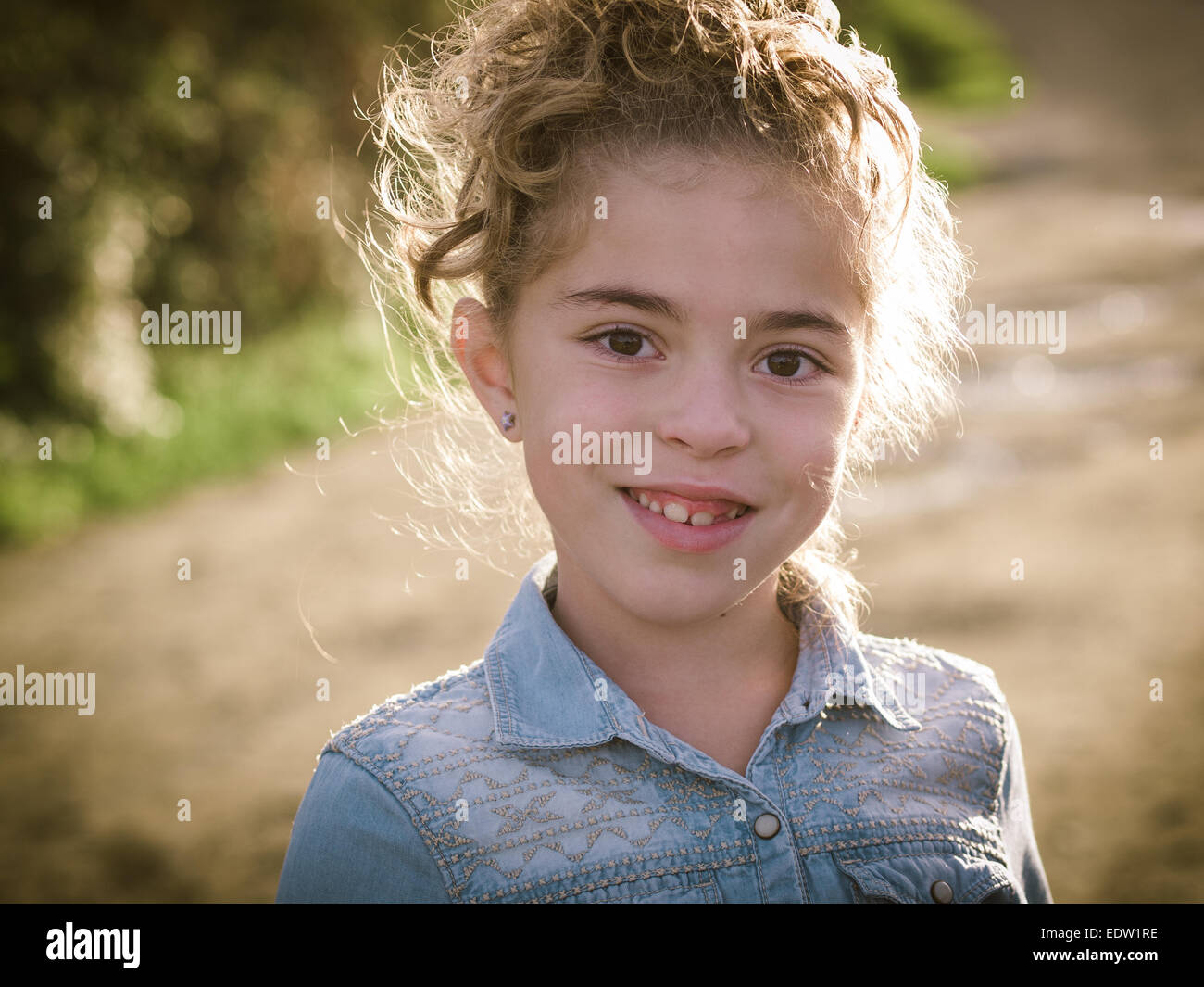 Little girl portrait with a big smile outdoors. Stock Photo