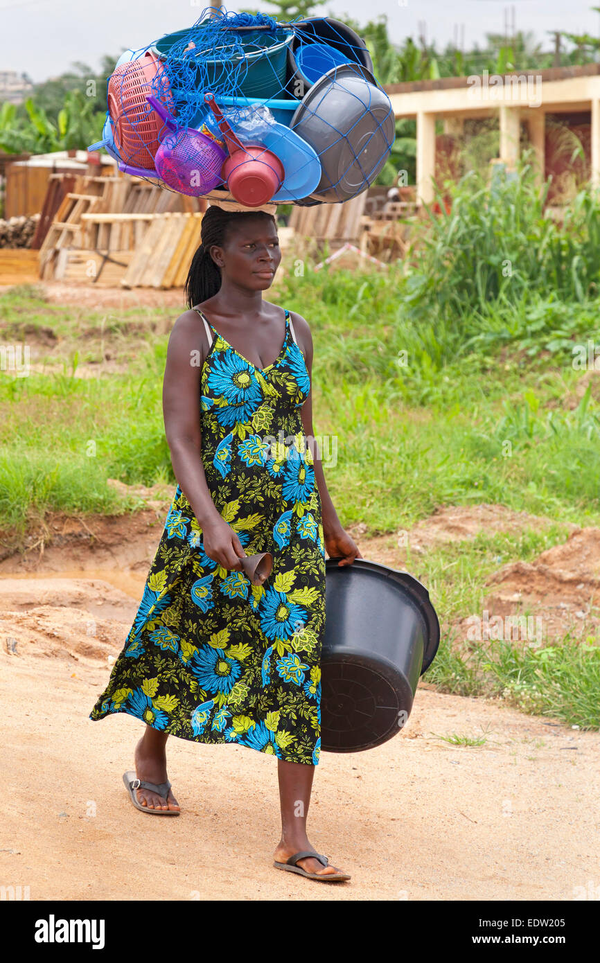 Vendor carrying goods on head, Accra, Ghana, Africa Stock Photo