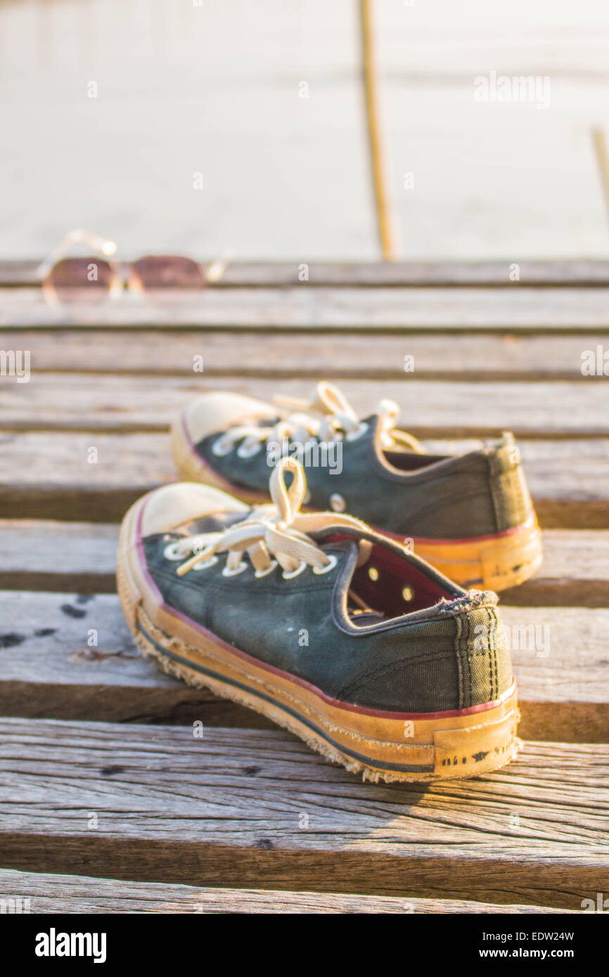 One pair of sneakers on the wooden Stock Photo - Alamy