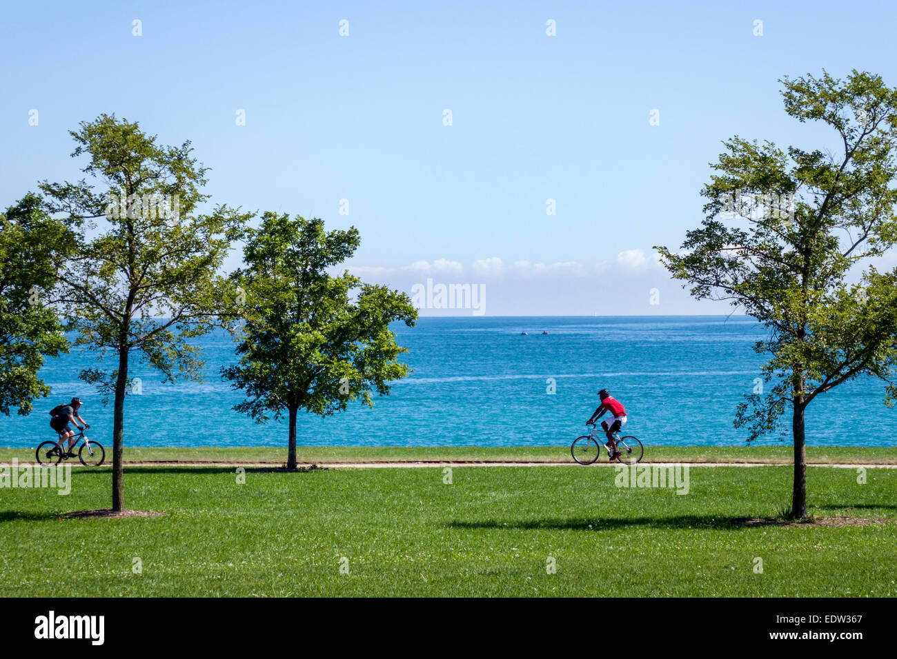 Chicago Illinois,South Side,Lake Michigan,39th Street Beach,Lakefront Trail,water,trees,bikers,riding,bicycle,bicycling,riding,biking,rider,rider,IL14 Stock Photo