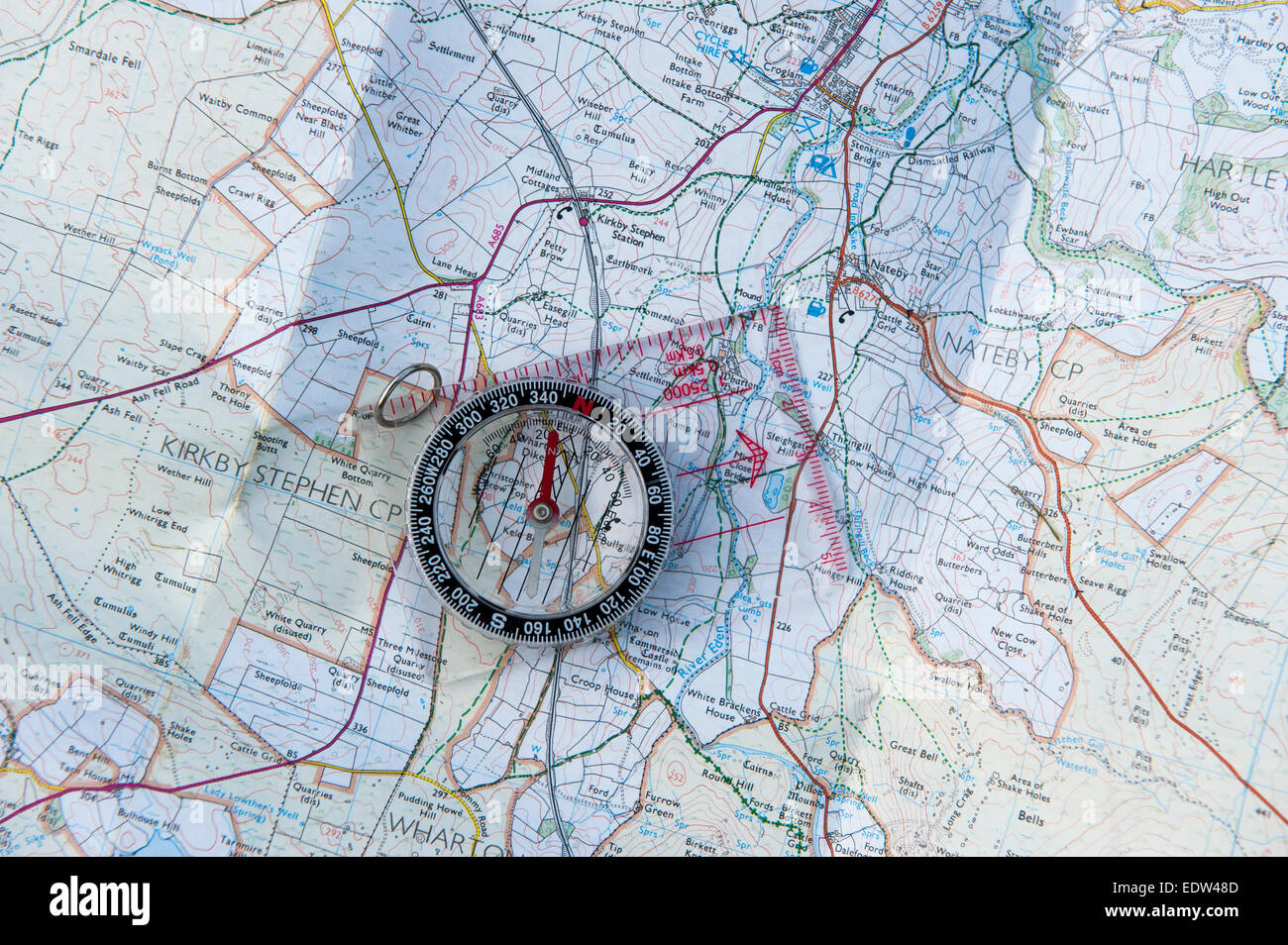 Compass on a detailed map. Stock Photo