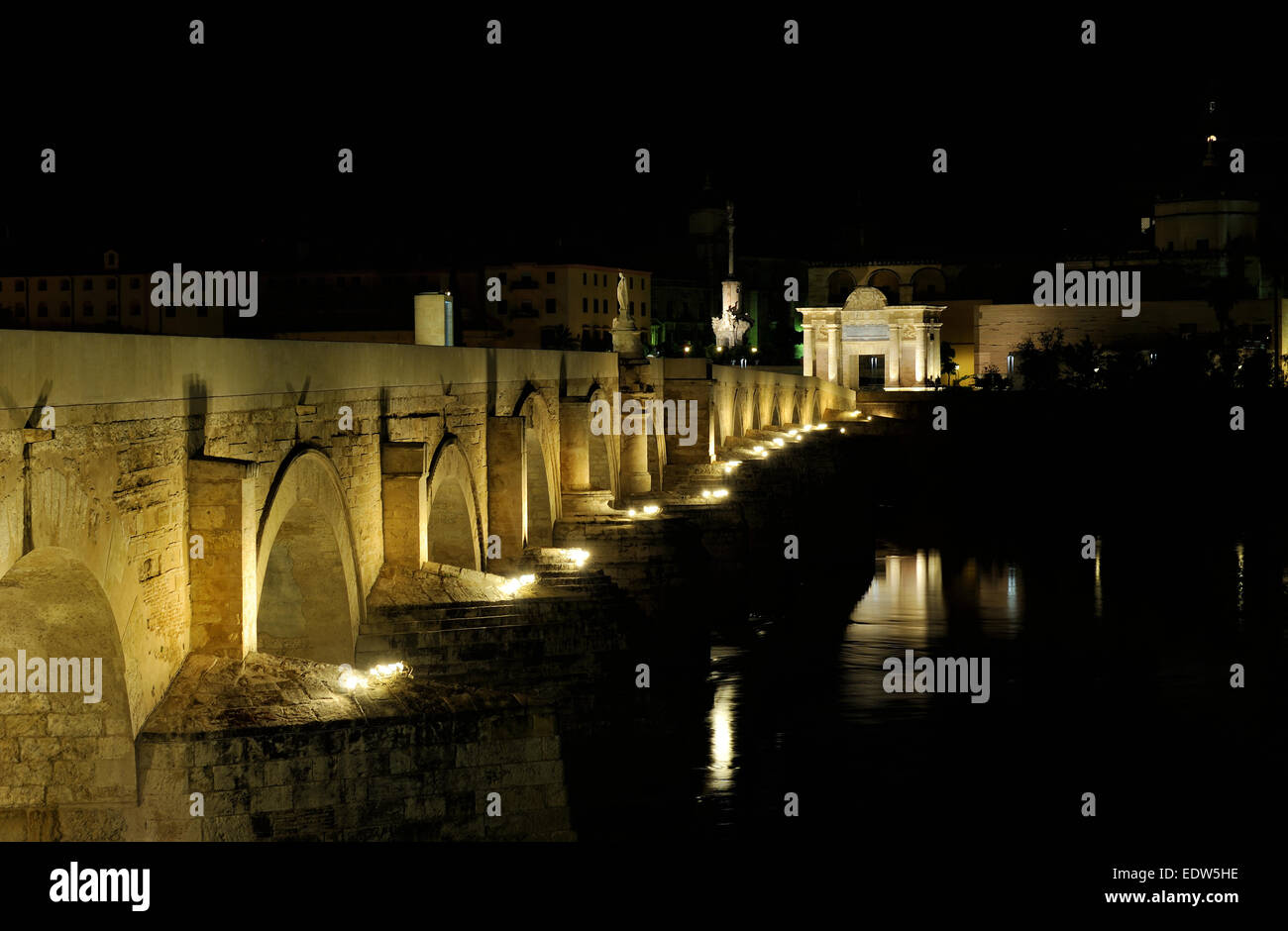 night view of Guadalquivir River and Romano Bridge, Cordoba,Spain Stock Photo