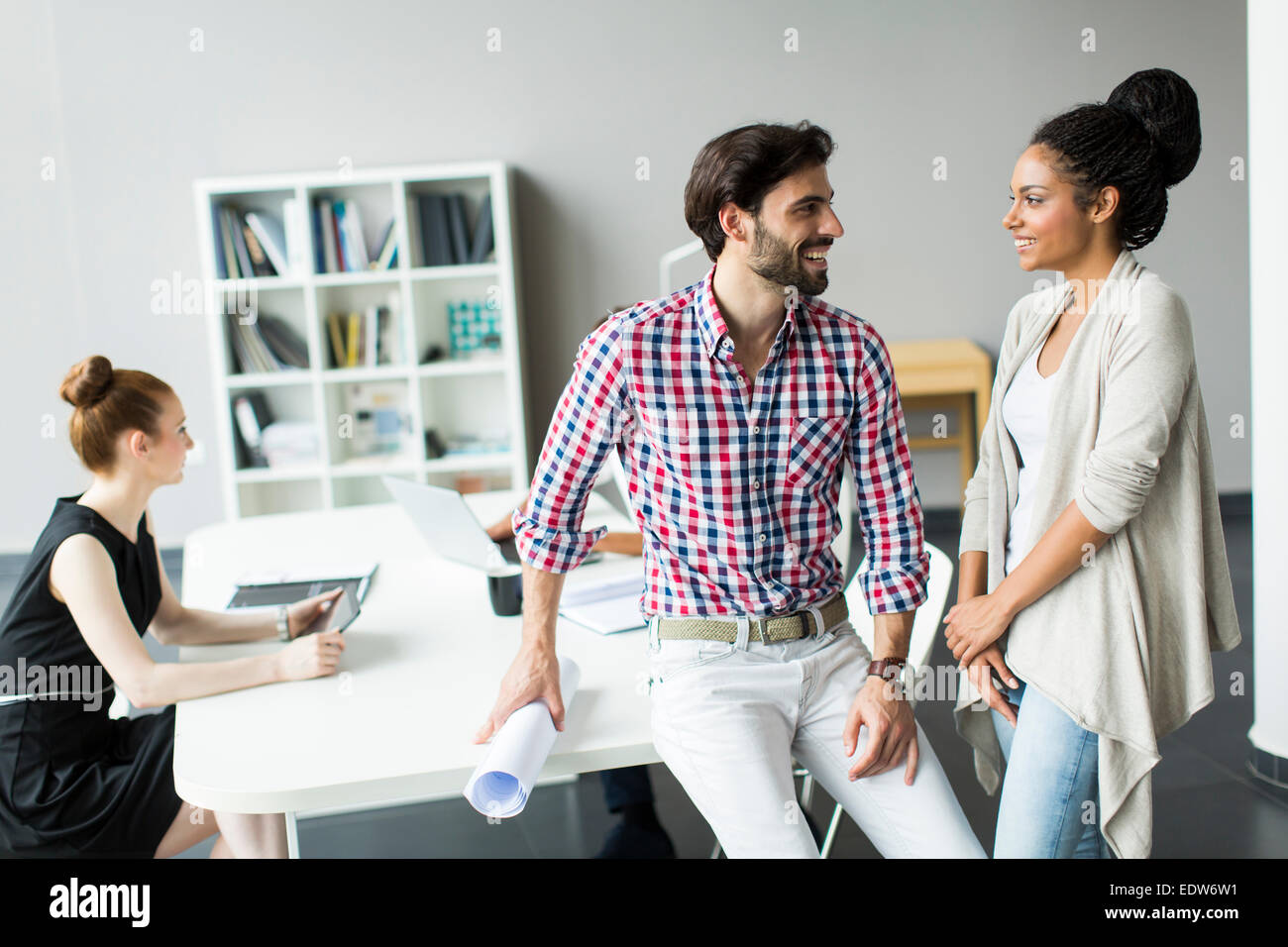 Young people in the office Stock Photo - Alamy