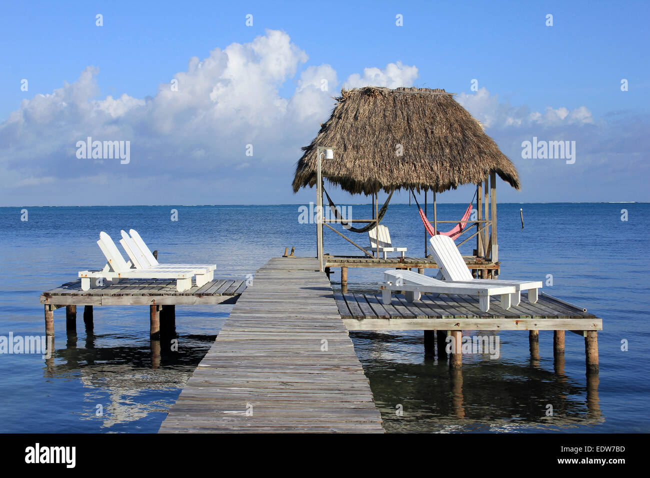 Wharf With Deckchairs On Caye Caulker, Belize Stock Photo