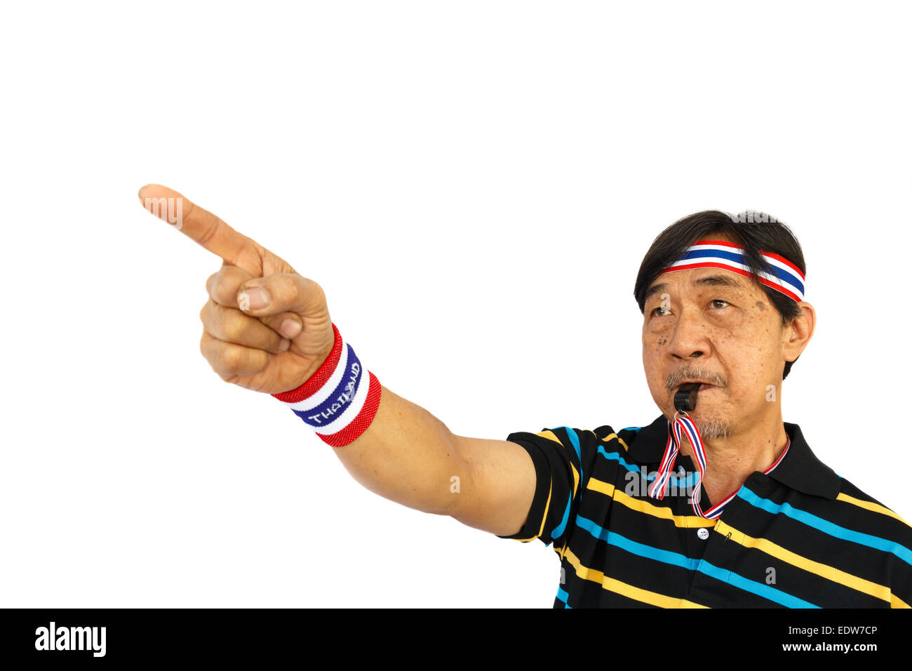 asian person is pointing a finger and blowing a whistle on white background (isolated) and blank area at upper side Stock Photo