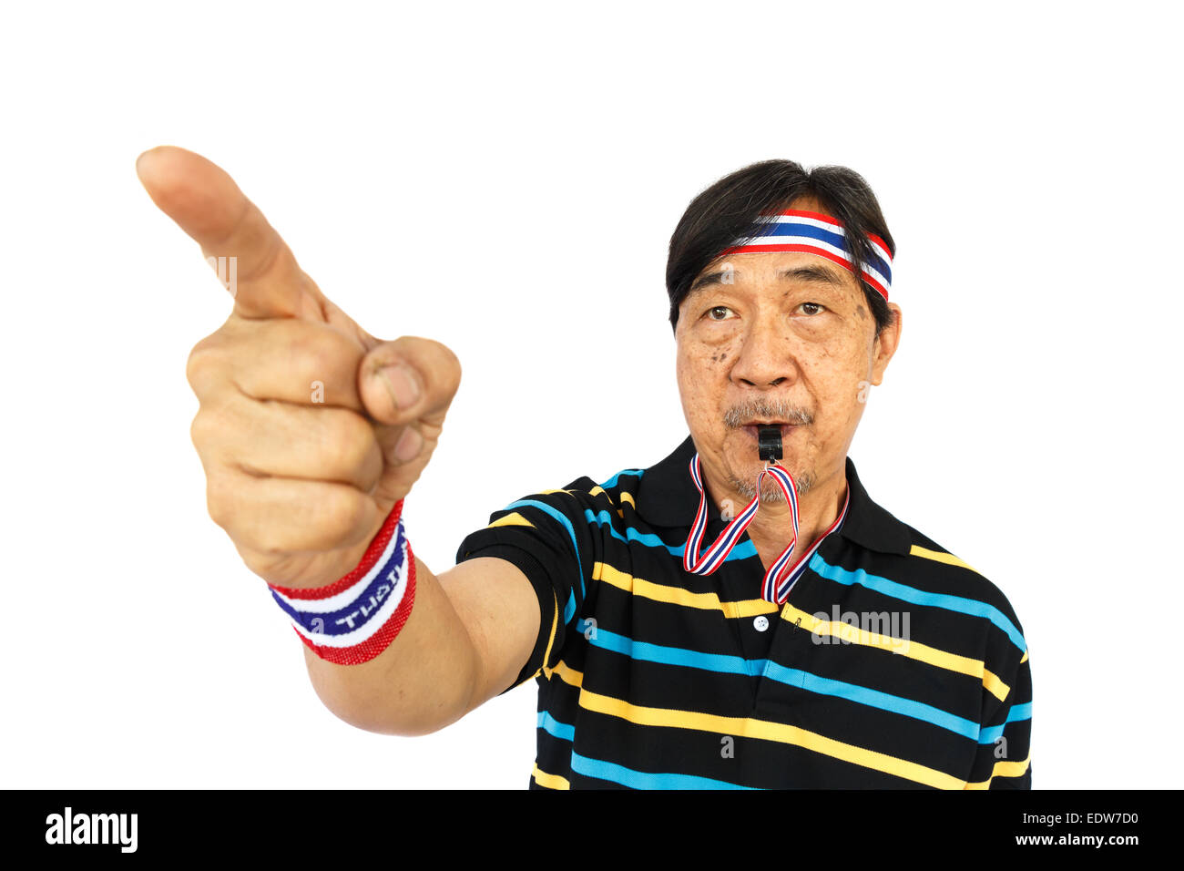 Thai man resist thai government (blow a whistle and wear wristband) on white background (isolated) Stock Photo