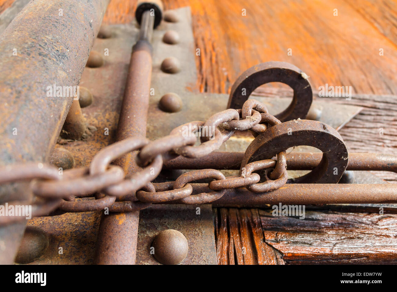 wood door was locked by rusty chain Stock Photo