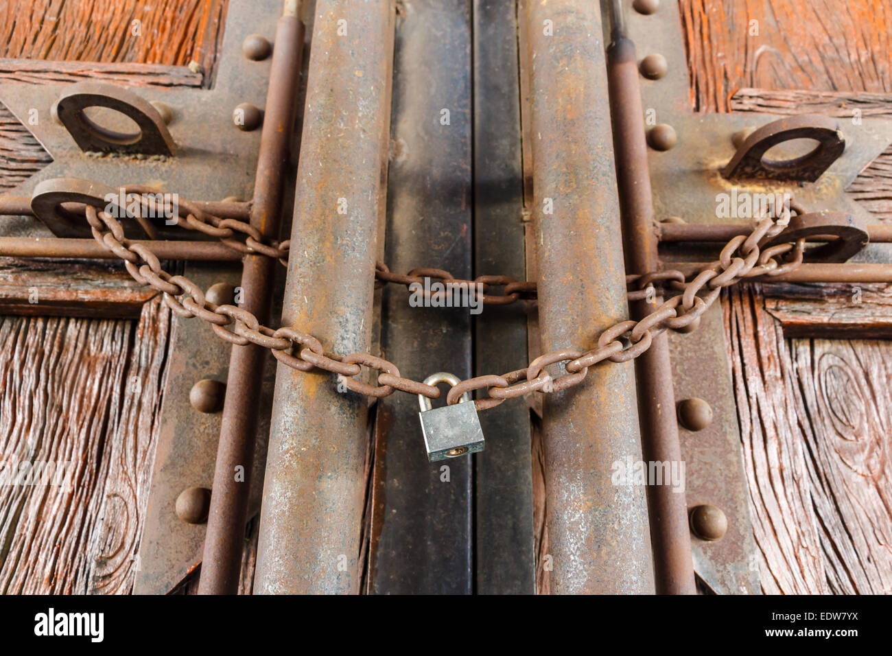 rusty chain and master key lock wood door Stock Photo