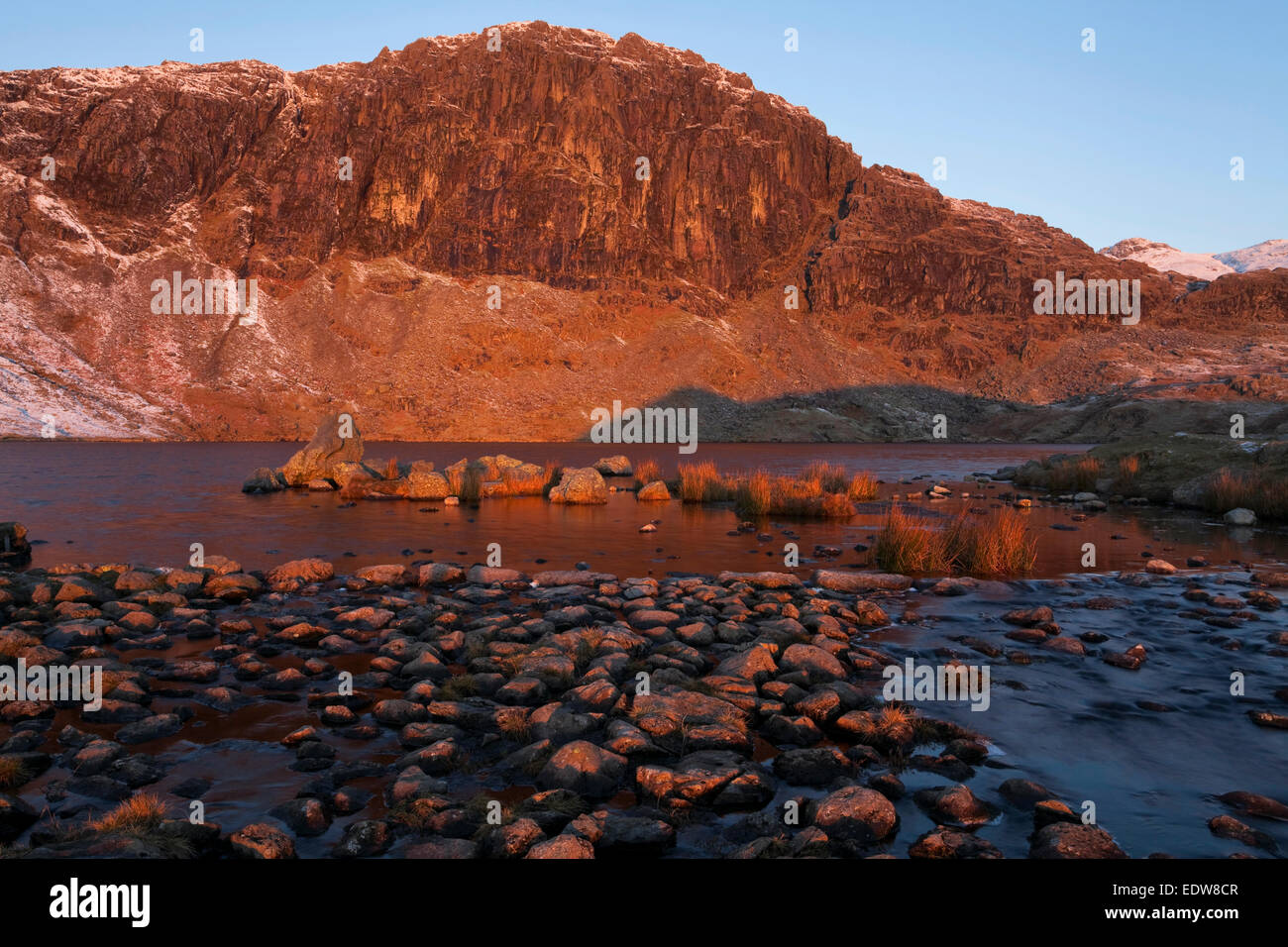 Pavey Ark and Stickle Tarn at dawn Stock Photo