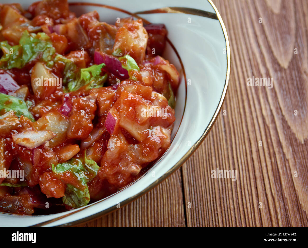 Tomatsild Norwegian dish of pickled herring, onion and tomato paste