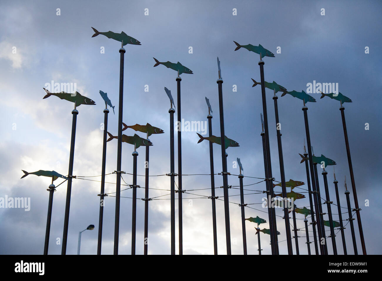 Southport, Merseyside, UK 10th January, 2014.  UK Weather. Low angle view of fish shaped wind sculptures on tall poles, indicating wind direction. Gale force winds and hail on the north-west sefton coast this morning. Credit:  Mar Photographics/Alamy Live News Stock Photo