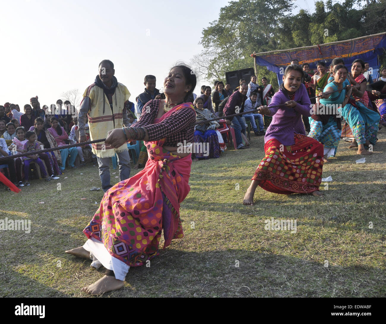 Majuli, Assam, India. 10th Jan, 2015. Mishing tribal girls wearing traditional attire participate in a Tug of war competition during a tribal festival in Majuli river island in Jorhat district of northeastern Assam state on January 10. 2015. Credit:  Luit Chaliha/ZUMA Wire/ZUMAPRESS.com/Alamy Live News Stock Photo