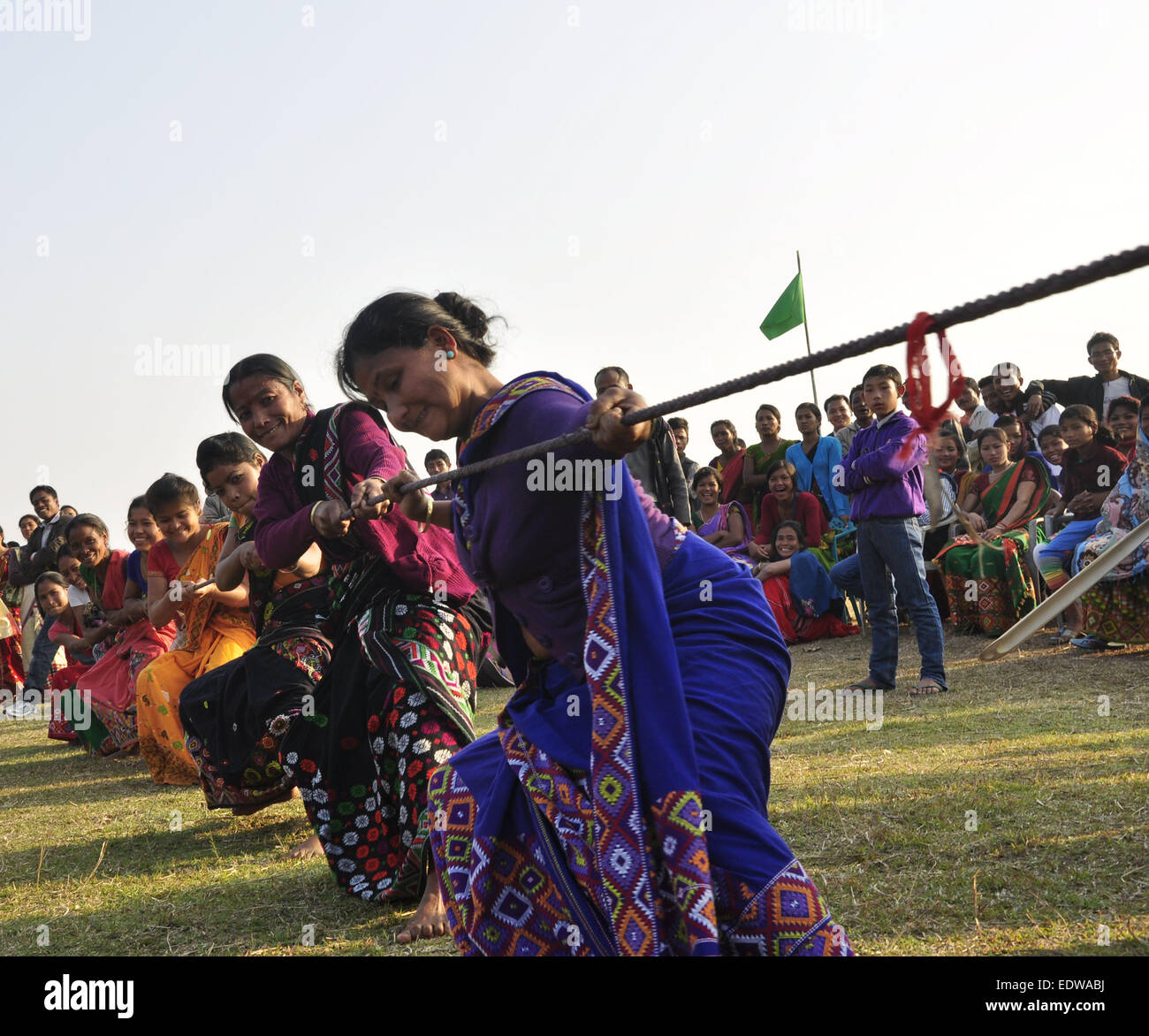 Majuli, Assam, India. 10th Jan, 2015. Mishing tribal women wearing traditional attire participate in a Tug of war competition during a tribal festival in Majuli river island in Jorhat district of northeastern Assam state on January 10. 2015. Credit:  Luit Chaliha/ZUMA Wire/ZUMAPRESS.com/Alamy Live News Stock Photo