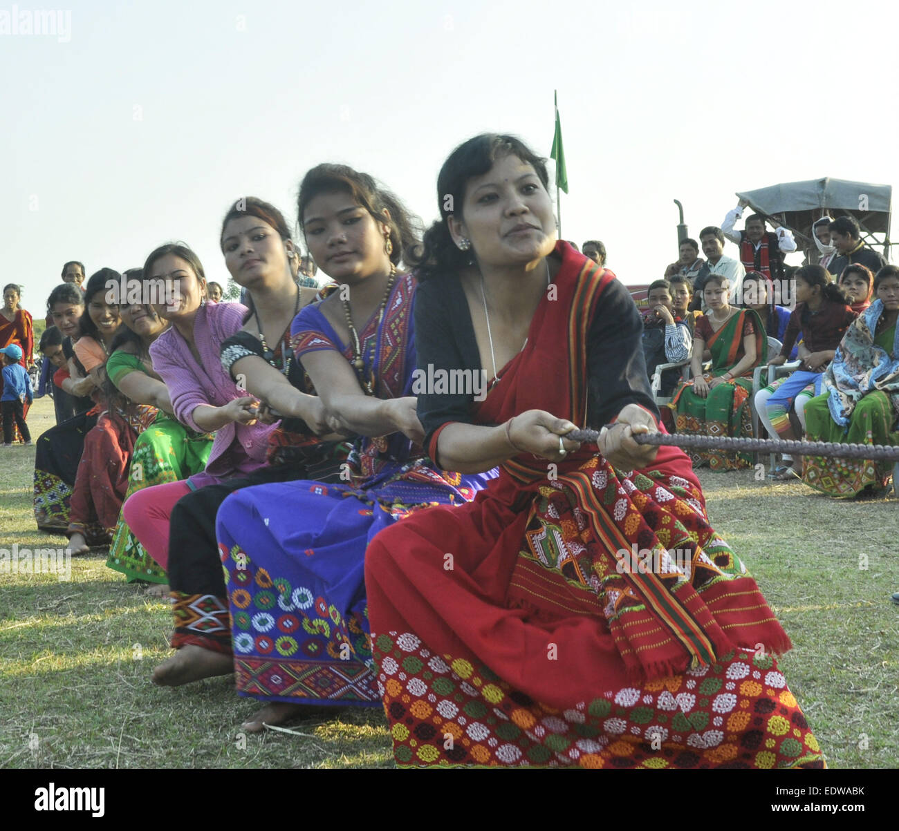 Majuli, Assam, India. 10th Jan, 2015. Mishing tribal girls wearing traditional attire participate in a Tug of war competition during a tribal festival in Majuli river island in Jorhat district of northeastern Assam state on January 10. 2015. Credit:  Luit Chaliha/ZUMA Wire/ZUMAPRESS.com/Alamy Live News Stock Photo