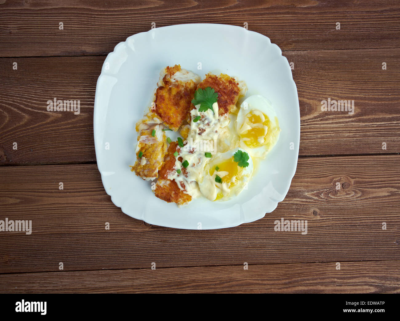 Finnan Haddie traditional Scottish breakfast. smoked haddock cooked with egg and sauce Stock