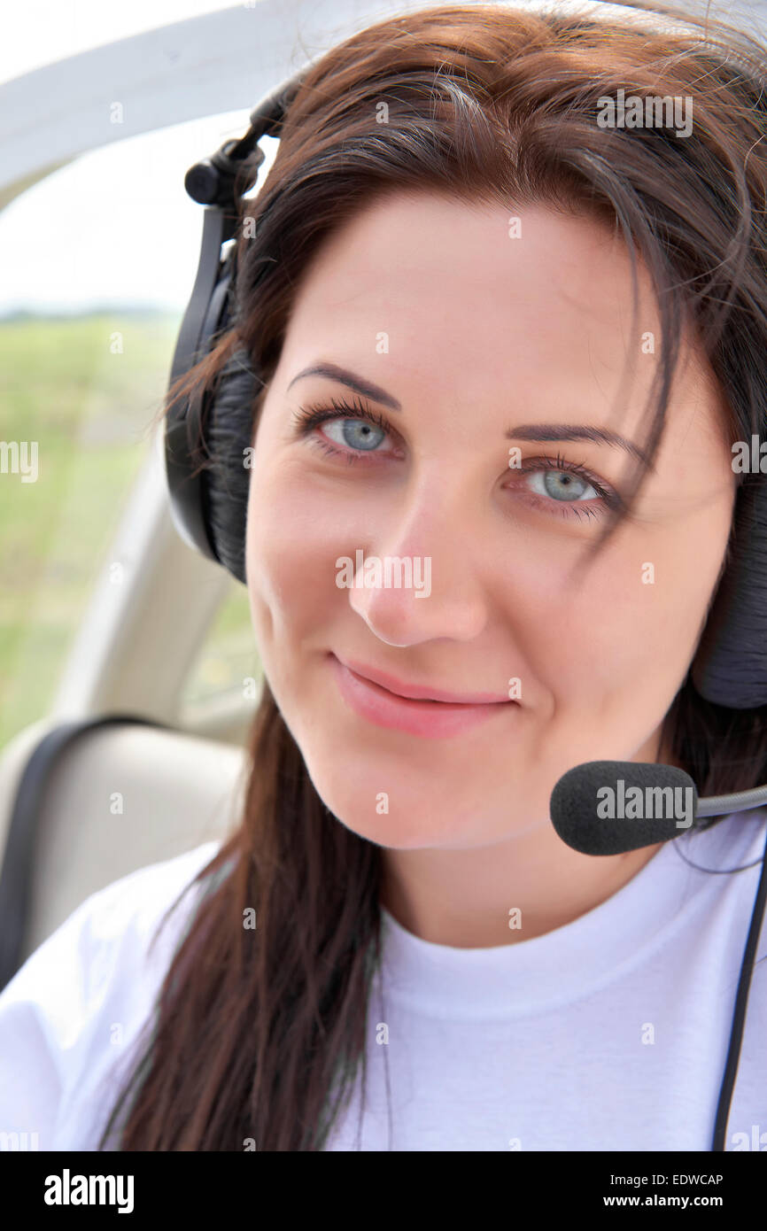 Portrait of a pilot girl in the cockpit Stock Photo