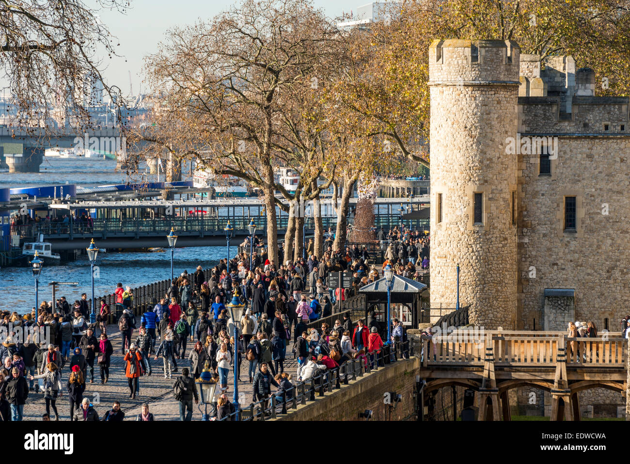 Tourists at the Wharf at the Tower of London and River Thames Stock Photo