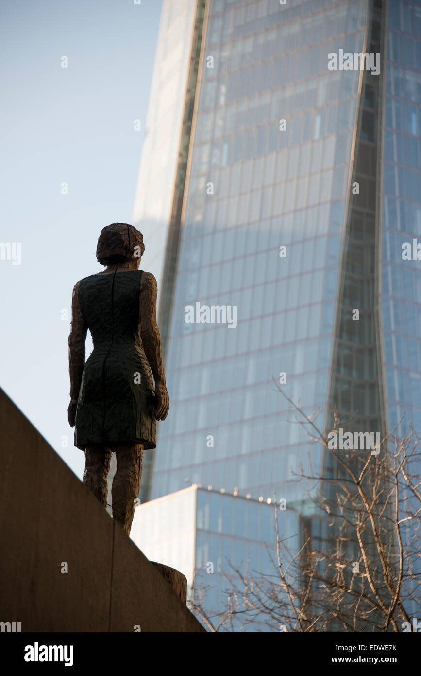A statue of a woman at More London looks out over the Shard, a mixed use skyscraper in south London Stock Photo