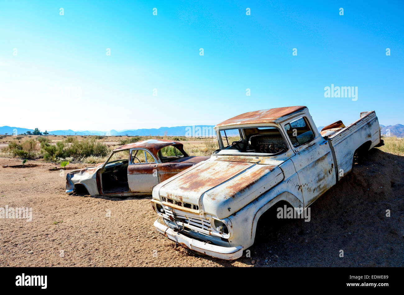 Abandoned car wrecks in the Namibian desert Stock Photo