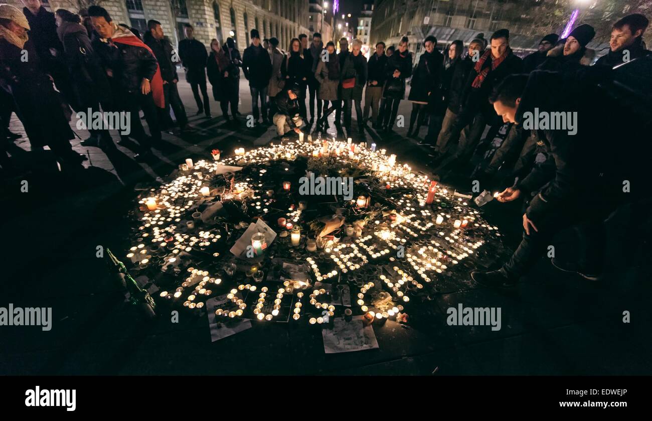 Paris France 8th January 15 People Gather Around A Set Of Lit Candles That Read Je Suis Charlie In French Meaning I Am Charlie Next To The Marianne Statue Of Republic Square