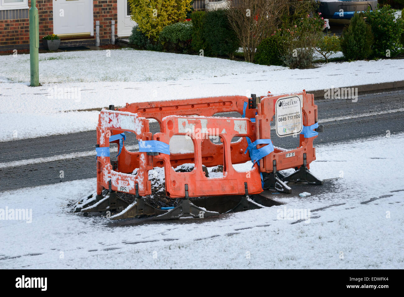 A burst water main under repair Stock Photo