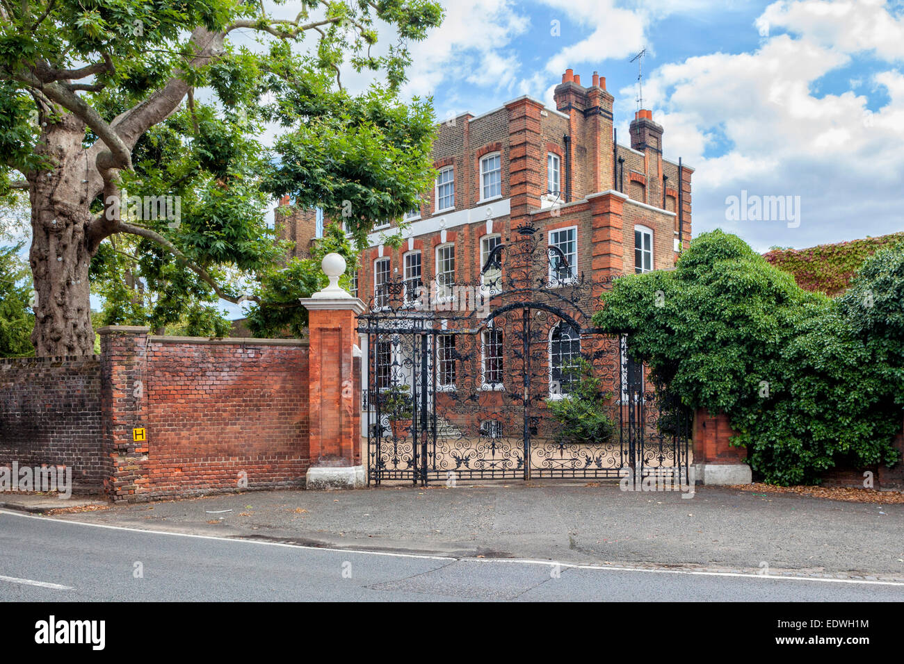 Montrose House, a grand brick listed home with ornate metal gates