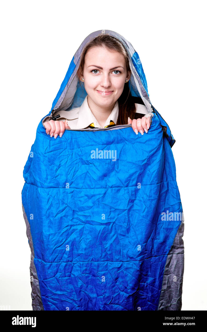 Girl inside the blue sleeping bag isolated on white background Stock