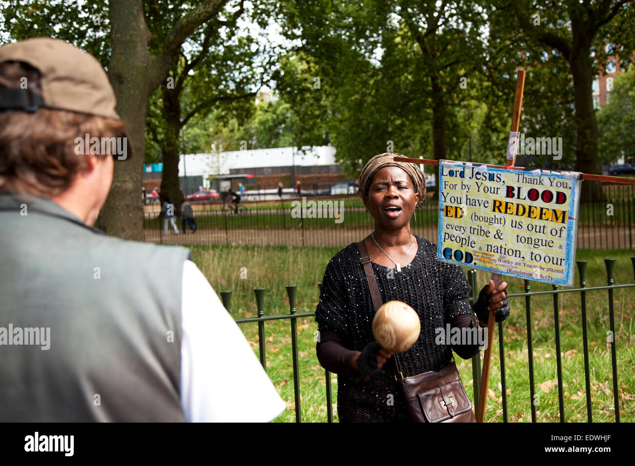 Woman speaker at Speakers Corner Hyde Park London where anyone can have free speech Stock Photo