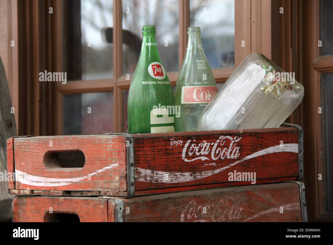 Antique bottles in a wooden Coca-Cola crate Stock Photo