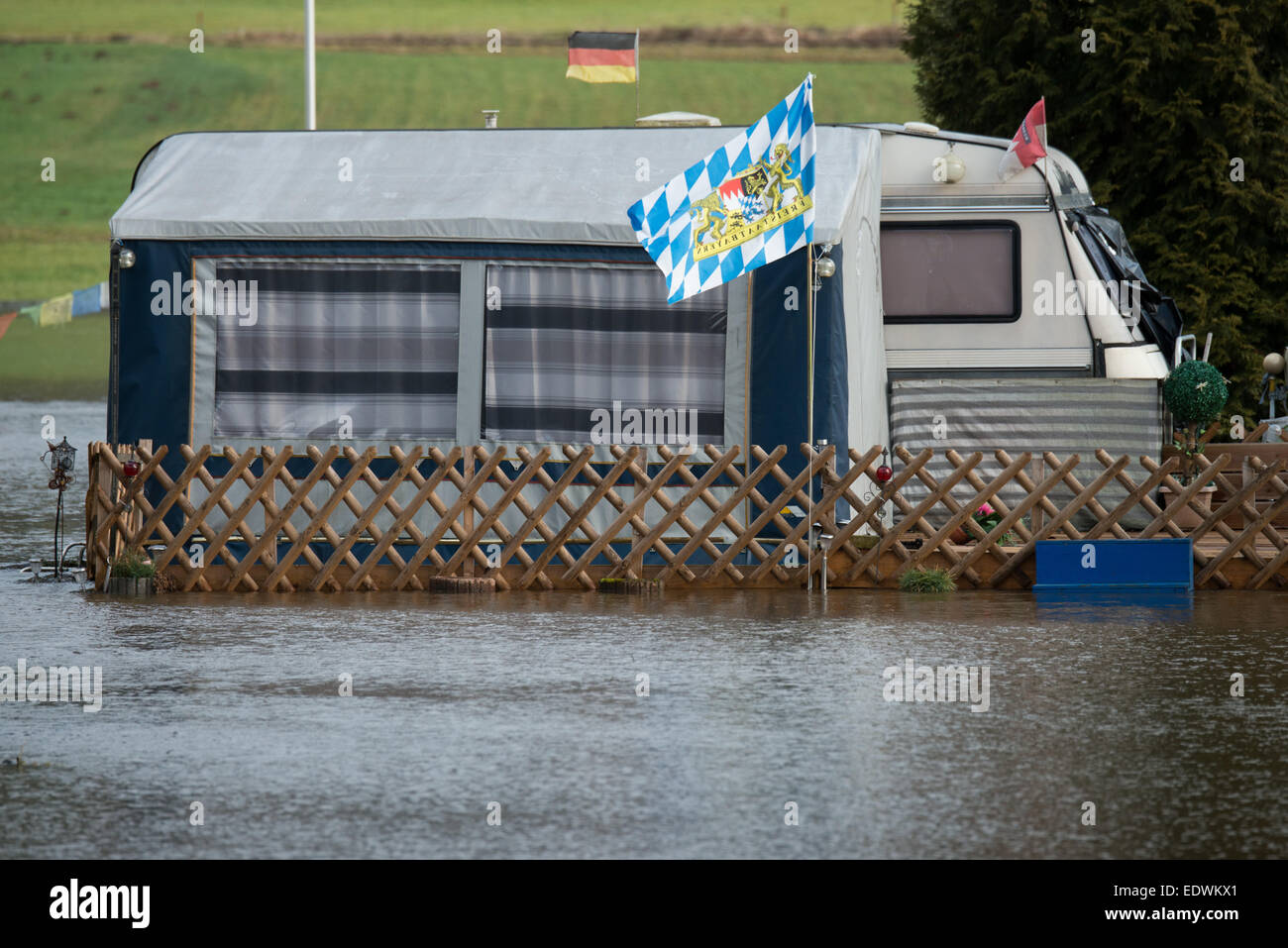 Bad Koetzting, Germany. 10th Jan, 2015. A trailer stands on a campsite flooded by the Weisser Regen river in Bad Koetzting, Germany, 10 January 2015. First floodings occured in Northern and Eastern Bavaria. For the weekend, the German Meteorological Service has announced more thaw. PHOTO: ARMIN WEIGEL/dpa/Alamy Live News Stock Photo