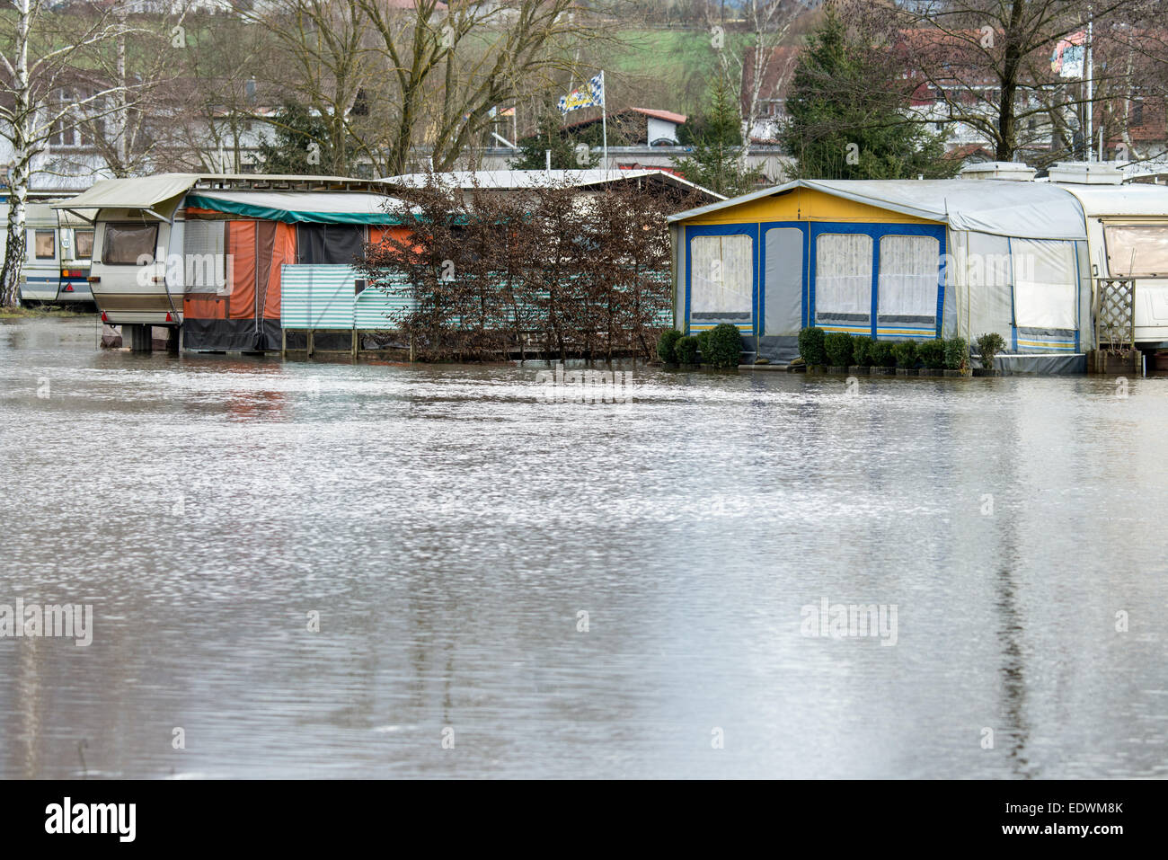Bad Koetzting, Germany. 10th Jan, 2015. Trailers stand on a campsite flooded by the Weisser Regen river in Bad Koetzting, Germany, 10 January 2015. First floodings occured in Northern and Eastern Bavaria. For the weekend, the German Meteorological Service has announced more thaw. PHOTO: ARMIN WEIGEL/dpa/Alamy Live News Stock Photo
