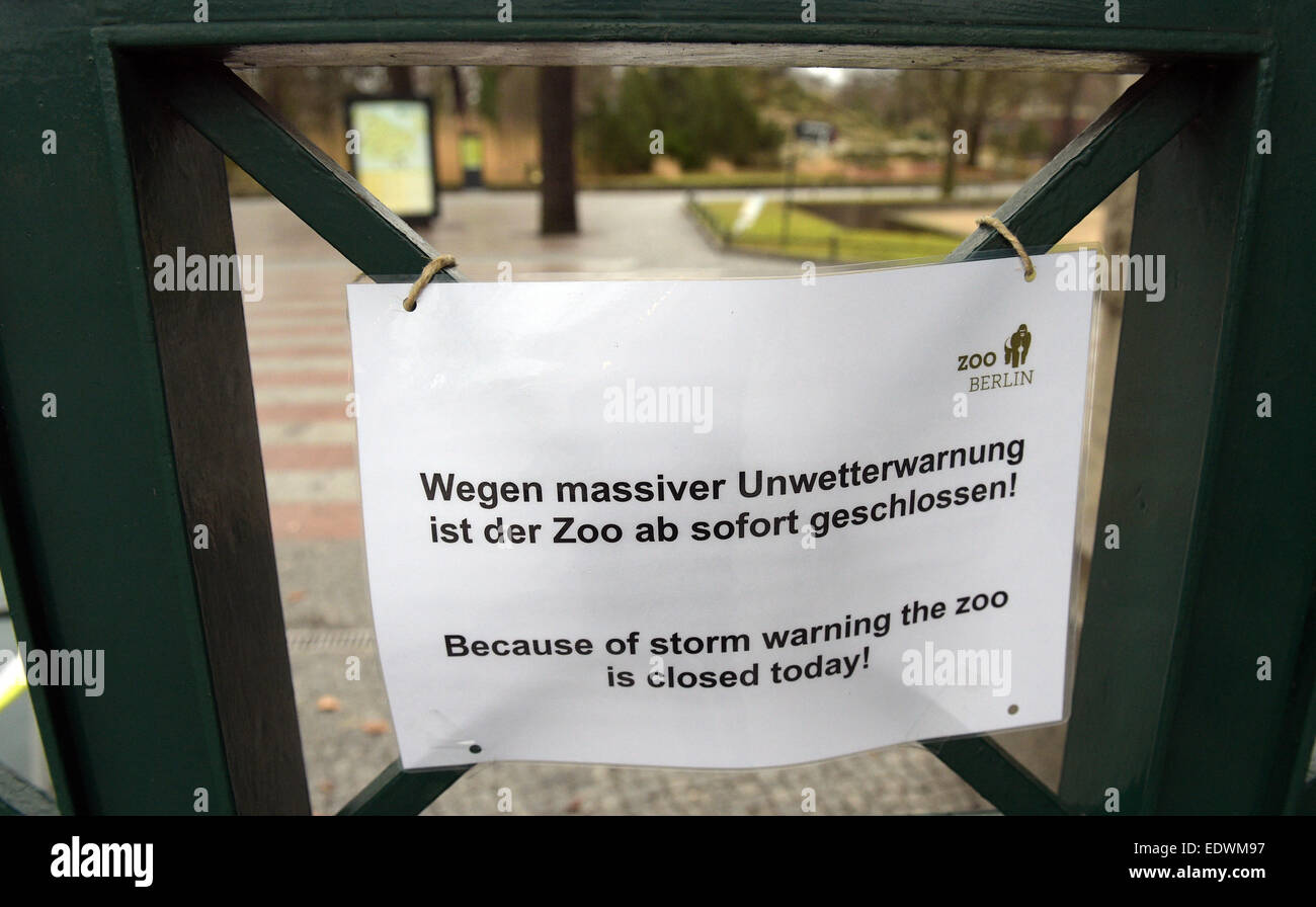 Berlin, Germany. 10th Jan, 2015. A sign attached to an entrance of the Zoological Garden reads, among other things, 'Wegen massiver Unwetterwarnung ist der Zoo ab sofort geschlossen' (lit. 'Because of an extreme weather warning the zoo is closed as of now') in Berlin, Germany, 10 January 2015. According to meteorologists, the weather is supposed to stay rainy and stormy in the coming days. PHOTO: RAINER JENSEN/dpa/Alamy Live News Stock Photo