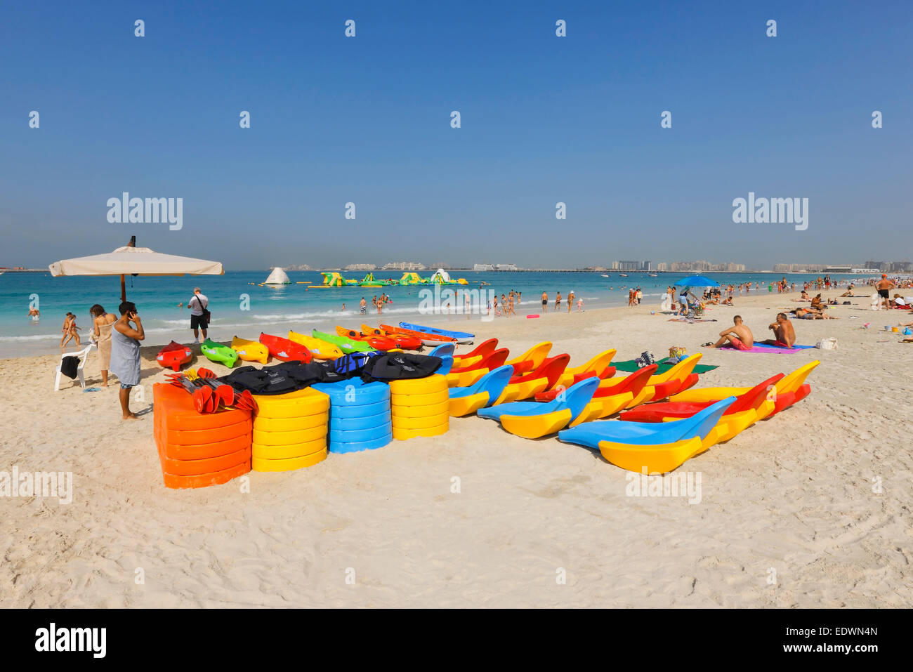 Dubai beach. Colorful plastic kayak boats at Jumeirah Beach Residence