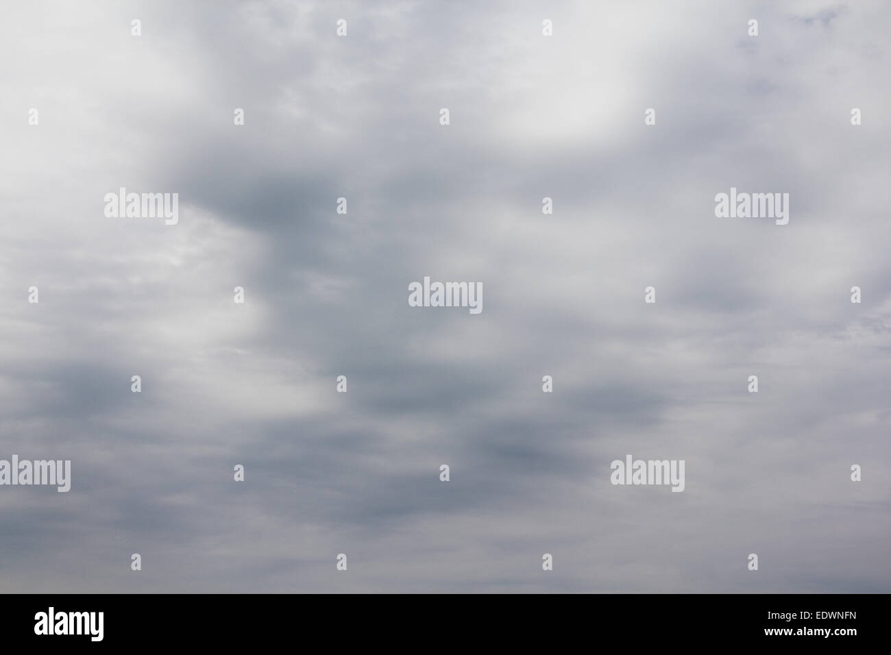 Background of Dramatic sky with Dark ominous grey clouds Stock Photo