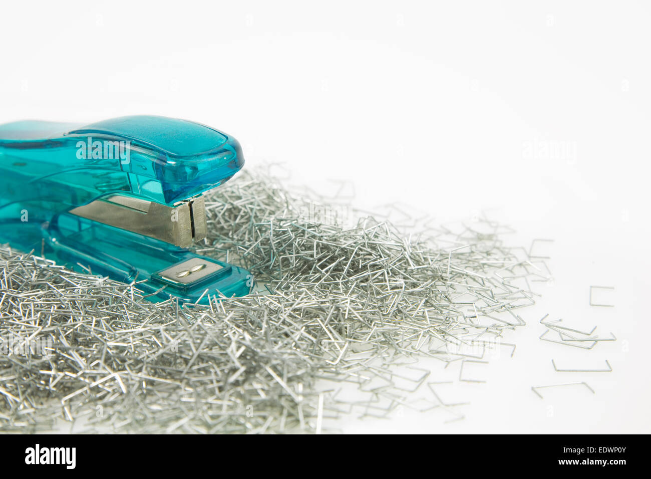 green Stapler and staples Isolated on a white background, Stock Photo